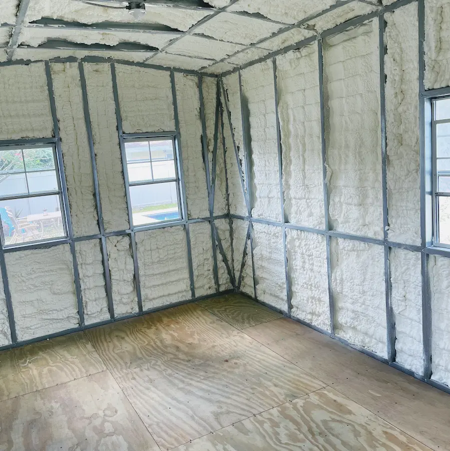 Closed-cell spray foam insulation applied to wall cavities in a residential project in Dover